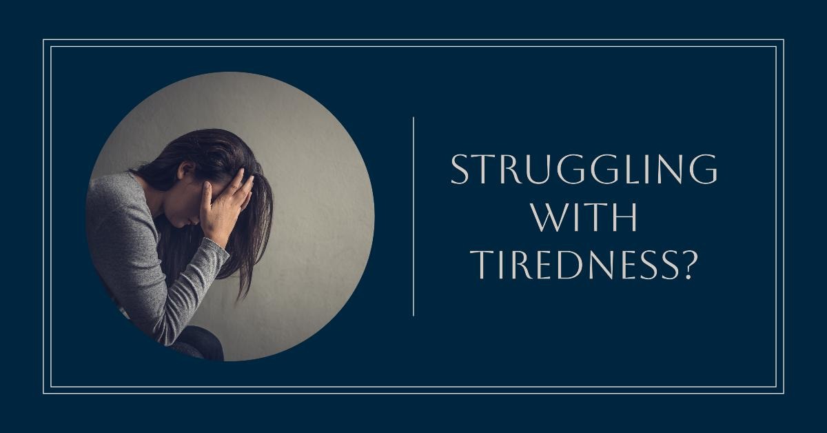 A woman tired, exhausted holding her head